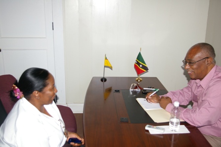 Premier of Nevis, Hon. Joseph Parry speaking to Mrs. Modesta Tyson at a One-on-One meeting.